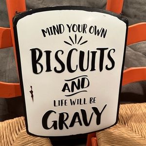Mind your biscuits sign